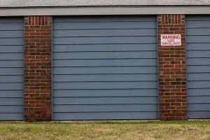 storage units with a sign showing video surveillance