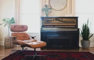 a piano and a chair in apartment