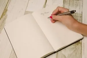 A person writing their plan