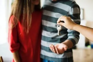 couple with keys in hand
