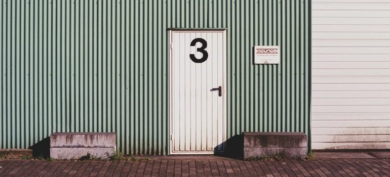 a storage unit with the number 3 on the door 