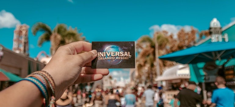 a person holding a Orlando Universal Resort card