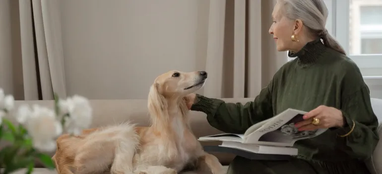 old woman talking with her pet about international relocation