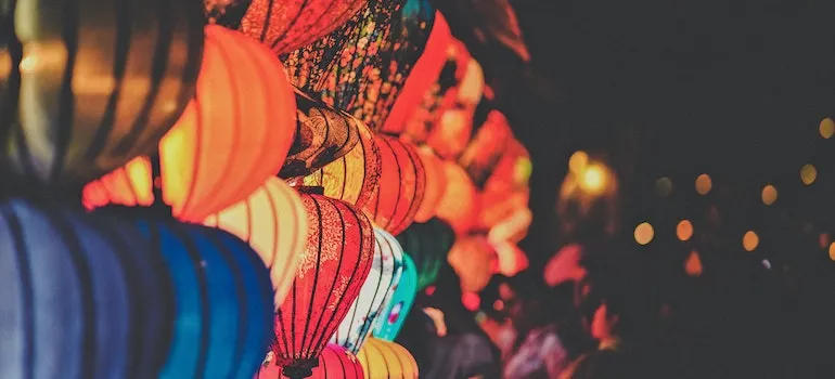 Colorful lamps illuminating a local festival with live music and cultural performances.